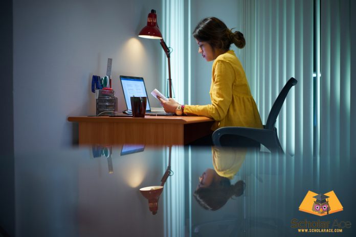 Girl writing expository essay on study desk